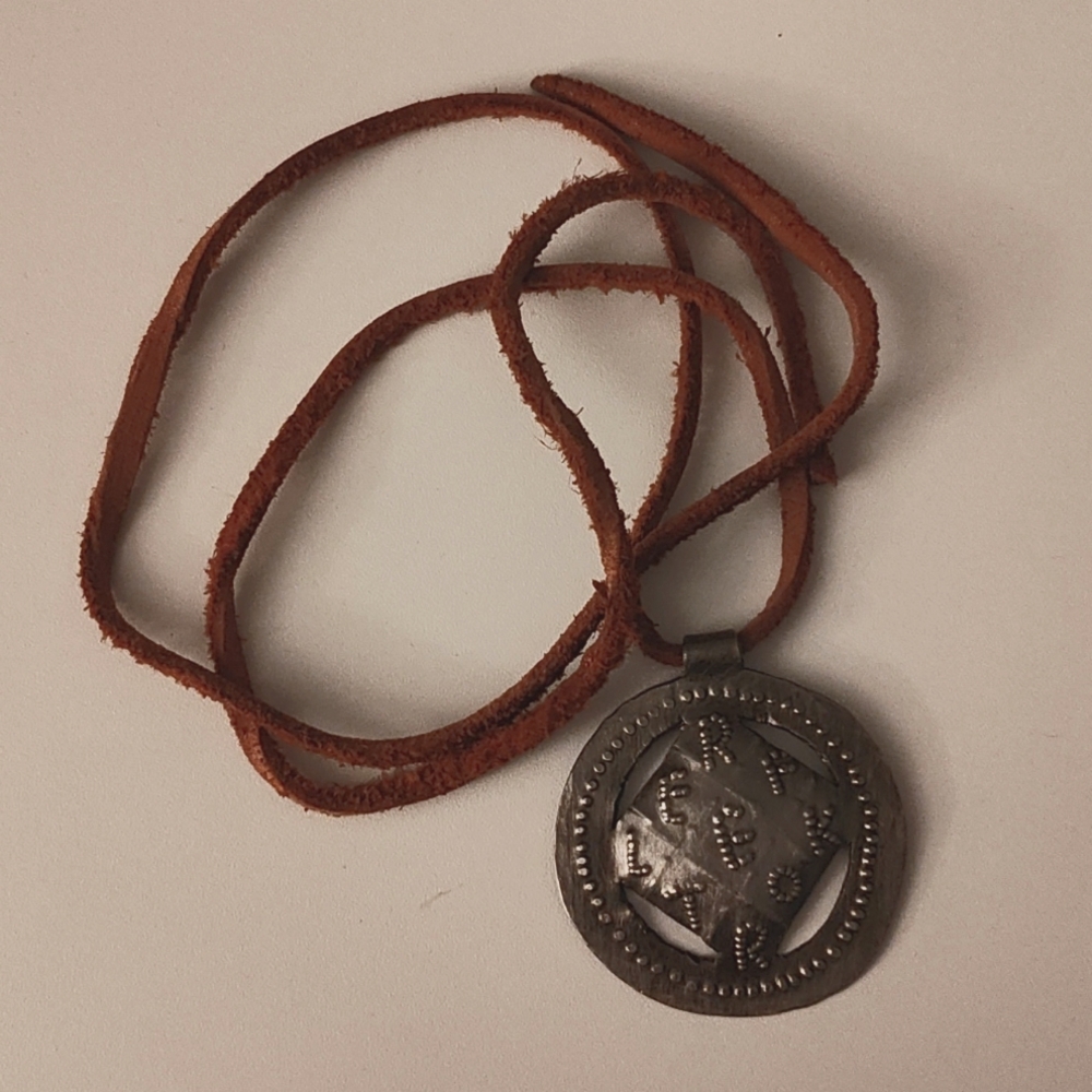 Stamped metal REFLEKTOR pendant (Arcade Fire merch)